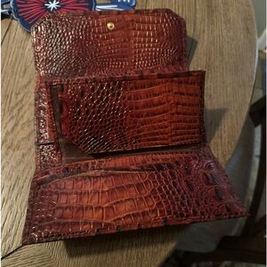 Pecan color wallet no scratches holds a checkbook and cover